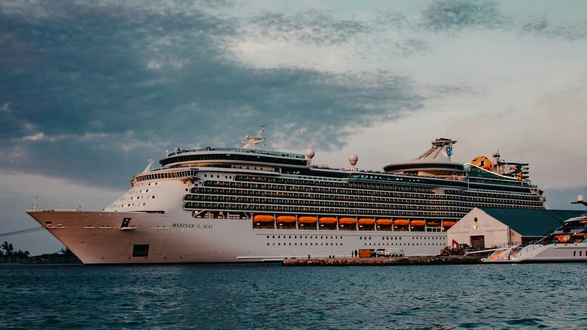 Royal Caribbean's Mariner of the Seas berthed at dusk, one of the 12 lines Costco Travel sells