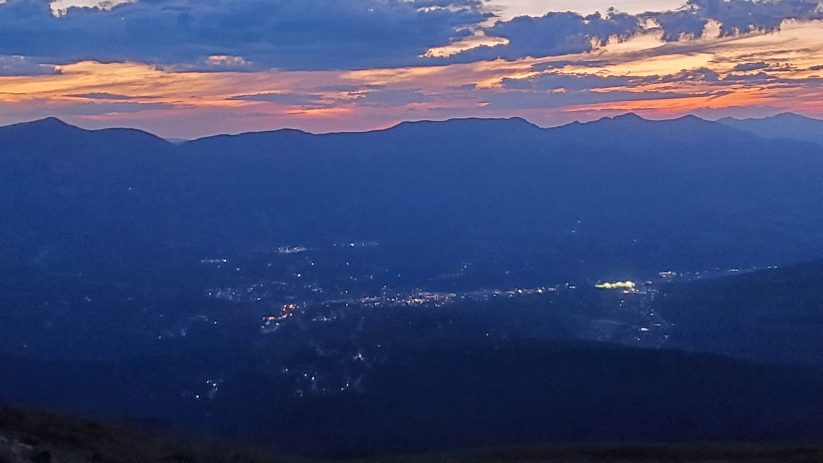 View of the mountain town of Breckenridge, Colorado, at sunset from Bald Mountain