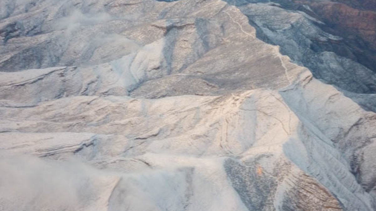 Aerial view of snow covered mountain ridgelines in the Spring Mountains near Las Vegas, seen from a departing flight