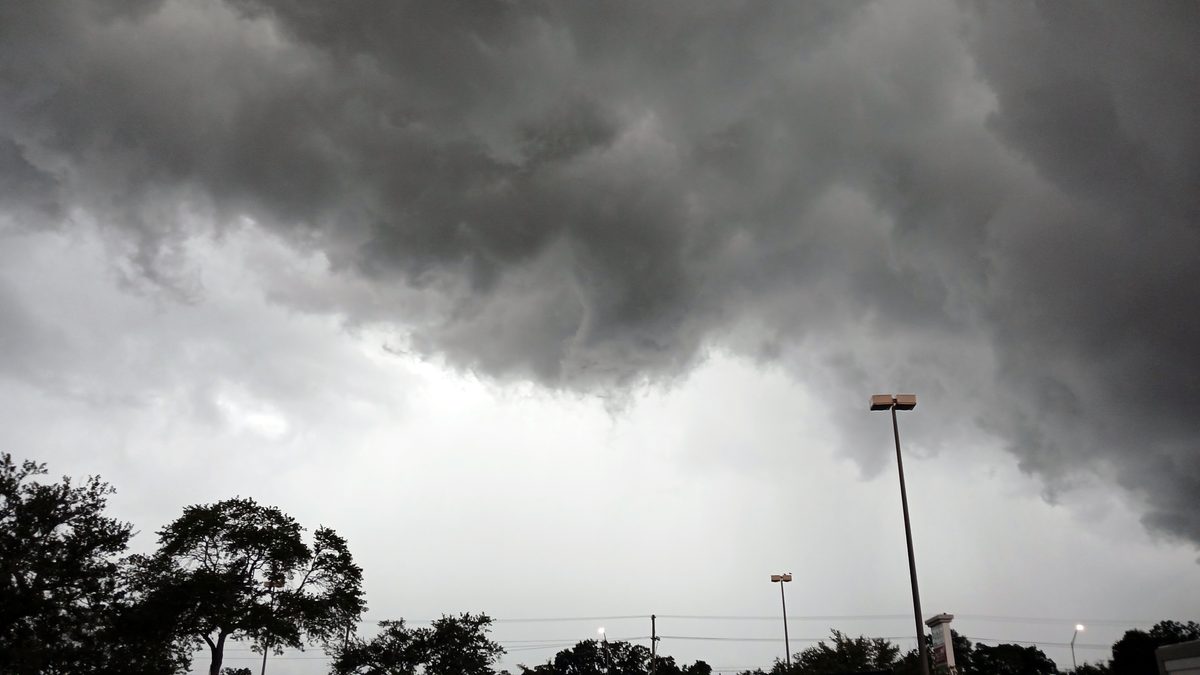 Dark storm clouds building over a parking lot in Tampa, Florida, before an afternoon thunderstorm