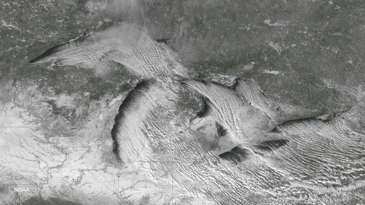 NOAA satellite image showing lake-effect snow bands streaming off the Great Lakes onto the surrounding land
